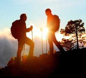 Hiking through Sri Lanka’s scenic landscapes – exploring lush forests, rugged trails, and mountain peaks, featured in JLK Tours adventure and trekking experiences.