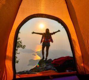Morning view from a camping site in Sri Lanka – misty mountains and tranquil nature, offering a serene start to the day, featured in JLK Tours outdoor and adventure experiences.