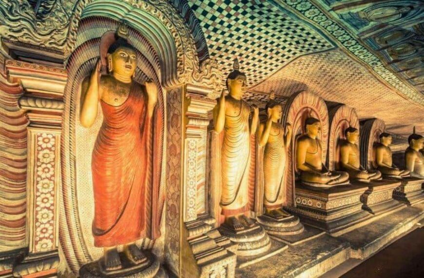 Entrance of Dambulla Cave Temple surrounded by rock formations in Sri Lanka