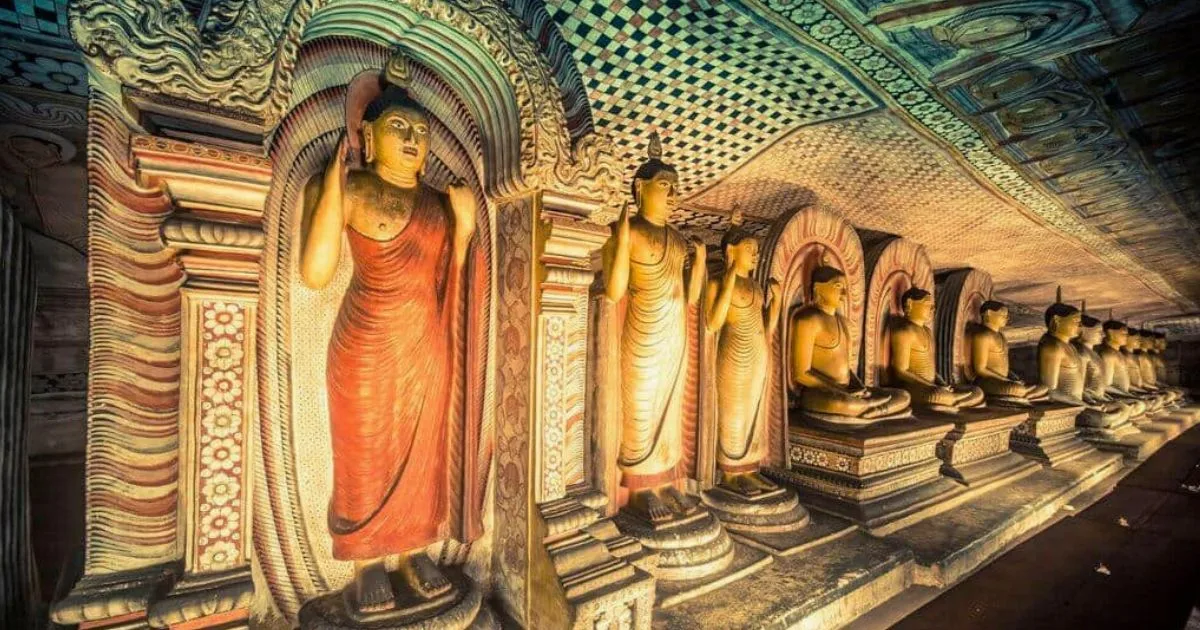Entrance of Dambulla Cave Temple surrounded by rock formations in Sri Lanka